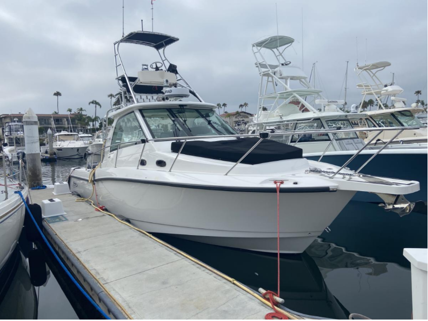 FIVE HOLE — Boston Whaler 345 Conquest at dock